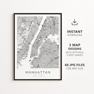 May include: Black framed Manhattan, New York map print. The map is in grayscale, showing streets and waterways. Text on the print includes "Manhattan, New York" and coordinates. Additional text indicates "Instant Download", "3 Map Designs", and "60 JPG Files".
