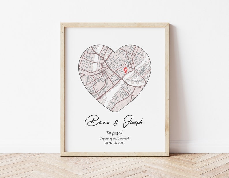May include: A printable engagement announcement with a heart-shaped map of Copenhagen, Denmark. The text reads "Becca & Joseph Engaged Copenhagen, Denmark 23 March 2023".