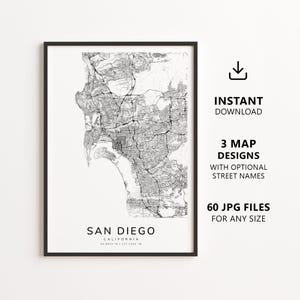 May include: A framed black and white map print of San Diego, California. The map shows the city's layout with streets and geographical features. Text on the print includes "San Diego, California" and download information.