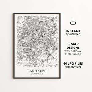 May include: A framed black and white map print of Tashkent, Uzbekistan, featuring a detailed street grid. The text below the map reads TASHKENT UZBEKISTAN 41.3111 N / 69.2797 E. To the right, text indicates INSTANT DOWNLOAD, 3 MAP DESIGNS, and 60 JPG FILES.