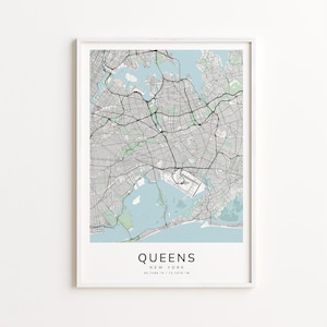 May include: A framed print featuring a detailed map of Queens, New York, with a light blue water background. The map shows roads and infrastructure in black and gray. The word "QUEENS" is printed in a bold font at the bottom.