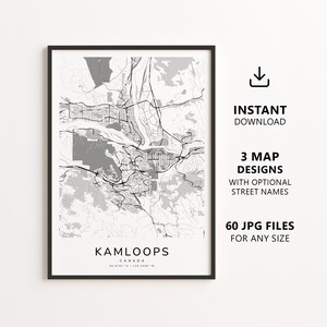 May include: A framed map print of Kamloops, Canada, featuring black street lines on a white and grey background. The text reads KAMLOOPS CANADA 50.6761 N / 120.3408 W. To the right, text states INSTANT DOWNLOAD, 3 MAP DESIGNS, and 60 JPG FILES.