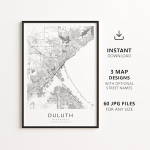 May include: A black and white map print of Duluth, Minnesota, featuring a detailed street grid, a black frame, and the text "DULUTH MINNESOTA 46.7756 N / 92.1393 W". To the right, text reads "INSTANT DOWNLOAD", "3 MAP DESIGNS", and "60 JPG FILES".