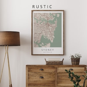 Mockup map print example. Map is displayed in a wooden frame on a white wall. The Interior could be described as rustic or farmhouse chic.
The example picture is in portrait. The displayed map is in a navy color palette.