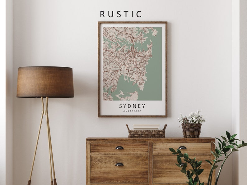 Mockup map print example. Map is displayed in a wooden frame on a white wall. The Interior could be described as rustic or farmhouse chic.
The example picture is in portrait. The displayed map is in a navy color palette.