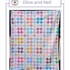 May include: A colorful quilt pattern titled "Olive and Nell" by Thimbles and Needles. The quilt features a white background with a repeating diamond pattern in various colors, including pink, blue, yellow, and green. The quilt is displayed against a neutral background.