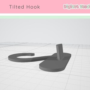 May include: A gray, tilted hook design with a rectangular base and a curved hook. The text "Tilted Hook" is above the hook, and the "Digicut Studio" logo is in the upper right corner. The hook is set against a white background with a grid pattern.