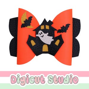 May include: A hair bow featuring a bright orange base layer and a black textured layer. The center displays a black haunted house with yellow windows, a white ghost, two black bats, and a yellow crescent moon. The text Digicut Studio is below.