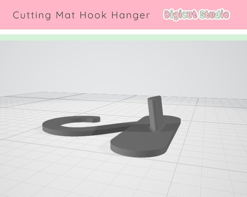 May include: A gray cutting mat hook hanger. The hanger has a curved hook shape connected to a rectangular base with a vertical post. The text "Cutting Mat Hook Hanger" and "Digicut Studio" are at the top.