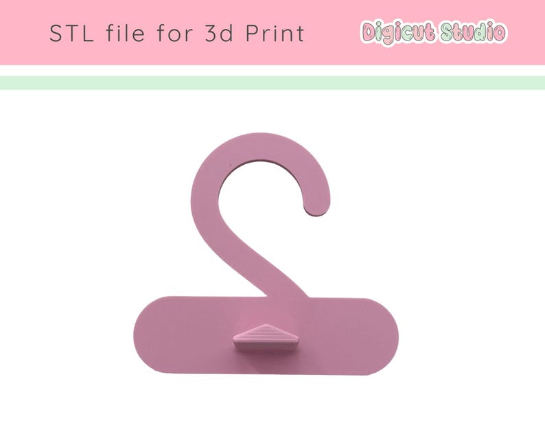May include: A light pink 3D-printed hanger with a curved hook and a rectangular base. The text "STL file for 3d Print" is at the top left, and "Digicut Studio" is at the top right.