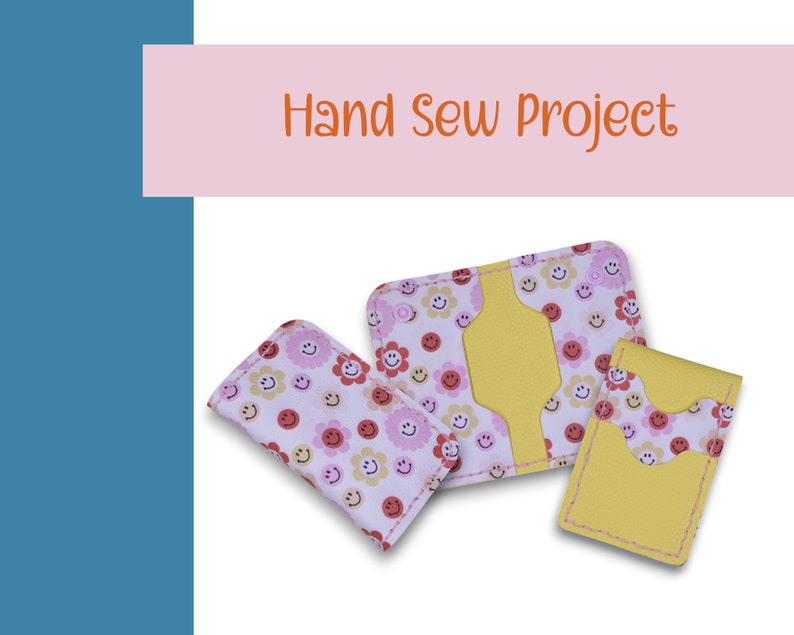 May include: Three hand-sewn wallets with a yellow fabric exterior and a pink and white fabric interior with a smiley face and flower pattern. The wallets are for holding cards and cash.