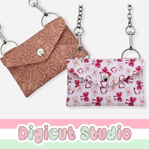 May include: Two small, decorative purses with silver chain straps. One is a dusty rose color with a floral lace pattern. The other is white with a pattern of red bows, hearts, and envelopes. Each purse has a silver snap closure.