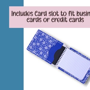 May include: Blue floral print notebook cover with a card slot. The cover is open, revealing a small notepad with lined paper. The text "Includes Card slot to fit business cards or credit cards" is displayed above the cover.