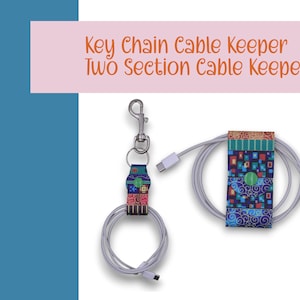 May include: A colorful patterned cable keeper with a key chain attachment. The cable keeper is designed to hold a charging cable and keep it organized. The cable keeper is made of fabric and has a green button.
