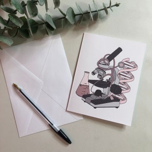 May include: A pink and gray illustrated card with a microscope, a beaker, and a double helix DNA strand. The card has a white background.