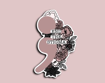 May include: A sticker with a pink and black semicolon surrounded by black and white floral designs. The text "END THE STIGMA" is written in black on a white background.