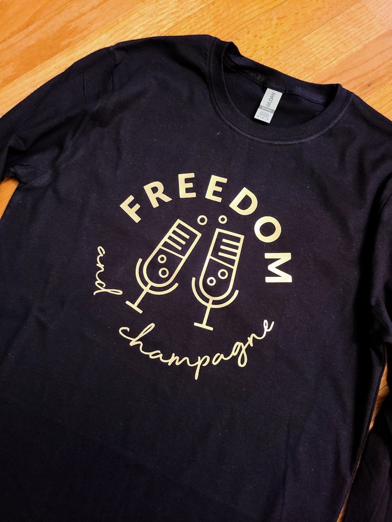 Freedom and Champagne Podcast unisex shirt. Long sleeved, COTTON soft feel, black shirt w/ gold logo. Supports black women owned companies. image 1