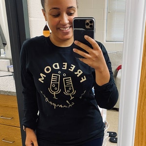 Freedom and Champagne Podcast unisex shirt. Long sleeved, COTTON soft feel, black shirt w/ gold logo. Supports black women owned companies. image 3