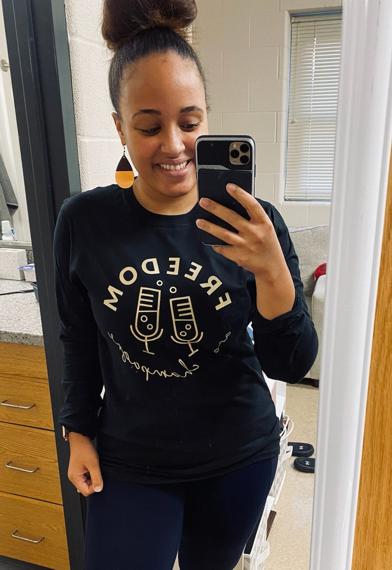 Freedom and Champagne Podcast unisex shirt. Long sleeved, COTTON soft feel, black shirt w/ gold logo. Supports black women owned companies. image 3