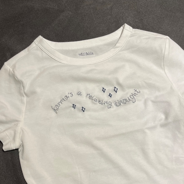 karma’s a relaxing thought embroidered baby tee!