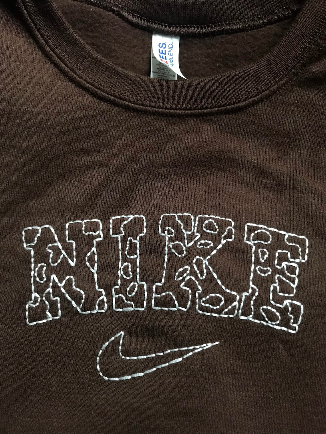 nike cow print embroidered sweatshirt