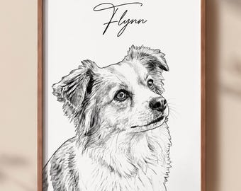 May include: A framed black and white pencil sketch of a dog with fluffy ears and a curious expression. The name Flynn is written in elegant black cursive script above the dog's head. The artwork is enclosed in a simple brown wooden frame.