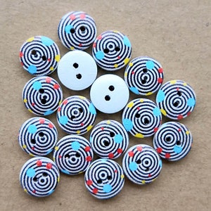 May include: Assortment of 15 wooden buttons with a black and white swirl pattern and colourful dots. The buttons have two holes each.