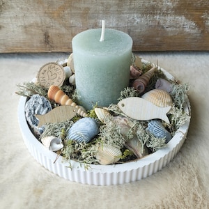 Maritime decoration shells candle sage