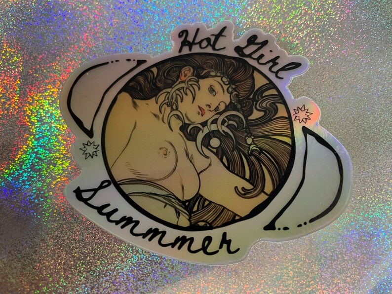 May include: Holographic sticker featuring a nude illustration of a woman with long hair, framed by crescent moons and stars. The words "Hot Girl Summer" are written in black script around the image. The sticker has a shiny, iridescent finish.