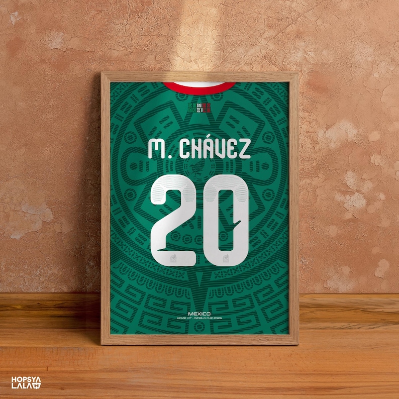 May include: A framed print featuring a green soccer jersey design with a red collar. The jersey displays the name M. CH&Aacute;VEZ and the number 20 in white. The background has a dark green Aztec-inspired pattern with the text MEXICO HOME KIT WORLD CUP 2022.