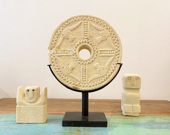 Carved stone wheel