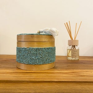 Cylindrical bamboo box & blue beads