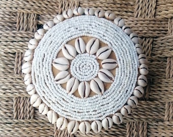 Round box of pearls and shells
