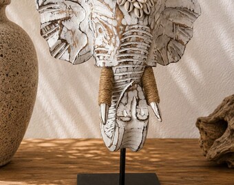 Elephant statue made of whitewashed wood and seashells