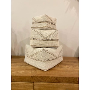 Beige and white decorative box made of bamboo and pearls