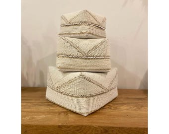 Beige and white decorative box made of bamboo and pearls