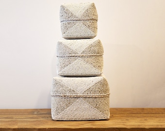 Beige and white decorative box made of bamboo and beads