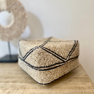 Beige and black decorative box made of bamboo and pearls