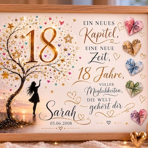 May include: A framed print featuring a silhouette of a person standing under a tree with gold stars and the number 18. The text reads: Ein neues Kapitel, eine neue Zeit, 18 Jahre, voller M&ouml;glichkeiten, die Welt geh&ouml;rt dir, Sarah, 05.06.2008. Five folded paper hearts are attached to the right side.