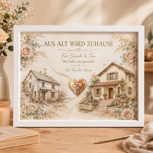 May include: A white framed print featuring a sketch of an old house on the left and a renovated house on the right, decorated with floral accents. The text reads AUS ALT WIRD ZUHAUSE, Für Sarah & Tim, Mit Liebe neu gemacht, Von Familie König.