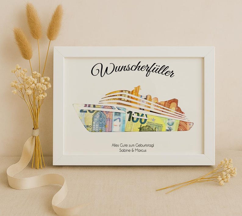 May include: White frame with a black and white image of a cruise ship made of euro bills. The text "Wunschersch&uuml;ller" is at the top of the frame. The text "Alles Gute zum Geburtstag Sabine & Marcus" is at the bottom of the frame.