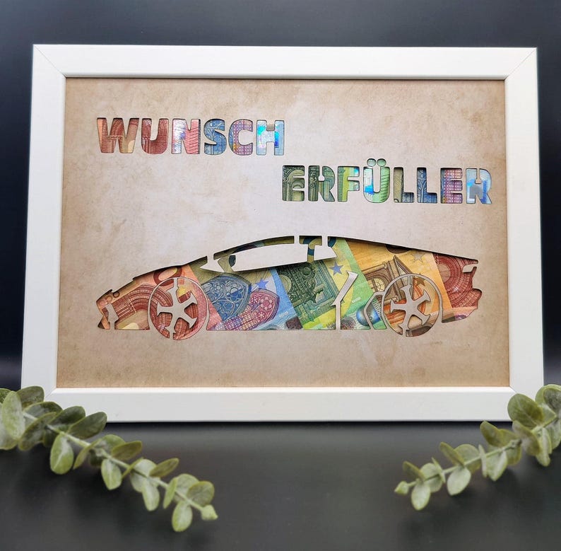 May include: A white rectangular frame containing a tan background with the cut-out text WUNSCH ERF&Uuml;LLER and a sports car silhouette. The cut-out areas reveal a collage of colorful Euro banknotes in various denominations behind the tan surface.