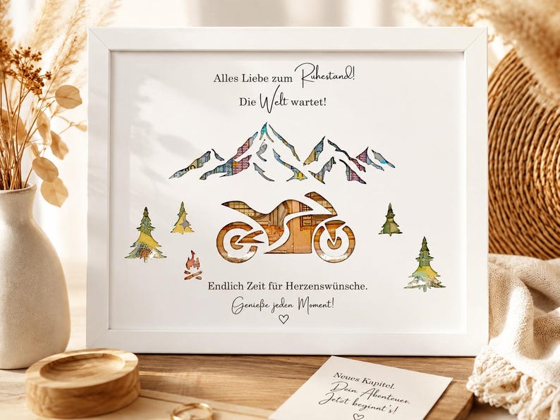 May include: A white framed print featuring a motorcycle silhouette filled with warm-toned patterns, set against a mountain range and pine trees. The text reads: Alles Liebe zum Ruhestand! Die Welt wartet! Endlich Zeit f&uuml;r Herzensw&uuml;nsche. Genie&szlig;e jeden Moment!