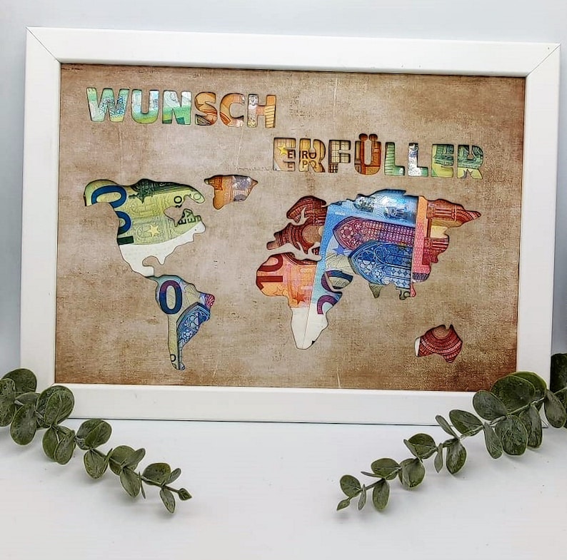 Puede incluir: Una imagen enmarcada en blanco con un mapa del mundo recortado del fondo. El mapa est&aacute; lleno de billetes de euro. El texto "Wunsch Erf&uuml;ller" est&aacute; en la parte superior de la imagen.