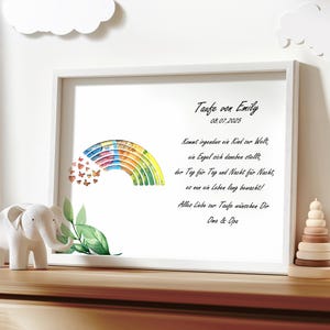 May include: A white frame with a rainbow and butterflies on a white background. The text in the frame reads "Taufe von Emily 08.07.2025 Kommt irgendwo ein Kind zur Welt, ein Engel sich daneben stellt, der Tag f&uuml;r Tag und Nacht f&uuml;r Nacht, es nur ein Leben lang bewacht! Alles Liebe zur Taufe w&uuml;nschen Dir Oma & Opa"