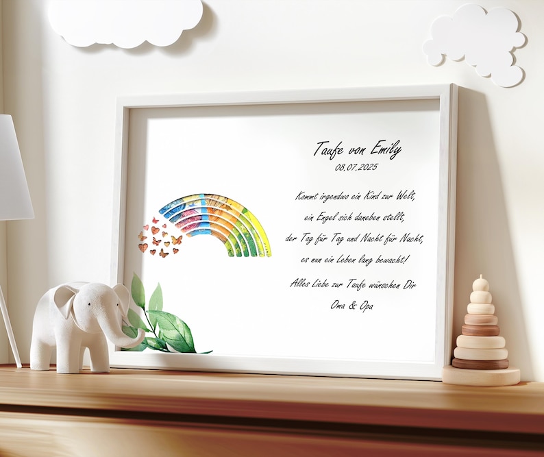 May include: A white frame with a rainbow and butterflies on a white background. The text in the frame reads "Taufe von Emily 08.07.2025 Kommt irgendwo ein Kind zur Welt, ein Engel sich daneben stellt, der Tag f&uuml;r Tag und Nacht f&uuml;r Nacht, es nur ein Leben lang bewacht! Alles Liebe zur Taufe w&uuml;nschen Dir Oma & Opa"