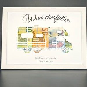 K&ouml;nnte beinhalten: Wei&szlig;er Rahmen mit einem Ausschnitt eines Wohnmobils, das mit Euro-Scheinen gef&uuml;llt ist. Der Text "Wunscherf&uuml;ller" befindet sich oben im Rahmen. Der Text "Alles Gute zum Geburtstag Sabine & Marcus" befindet sich unten im Rahmen.