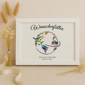 May include: White framed picture with a colorful globe and the text "Wunsch erf&uuml;ller" and "Alles Gute zum Geburtstag Sabine & Marcus".