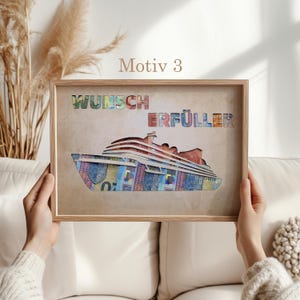 May include: A framed print with a brown background and a white cruise ship made of colorful paper money. The ship is labeled "Wunsch Erf&uuml;ller" which translates to "Wish Fulfiller".
