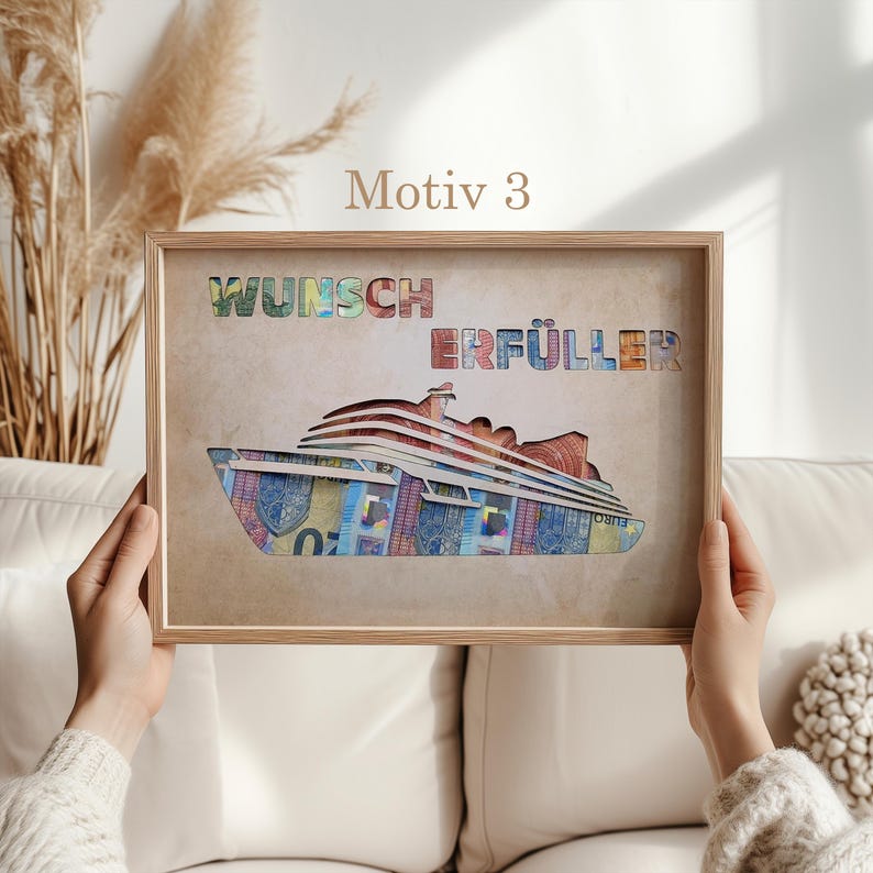 May include: A framed print with a brown background and a white cruise ship made of colorful paper money. The ship is labeled "Wunsch Erf&uuml;ller" which translates to "Wish Fulfiller".